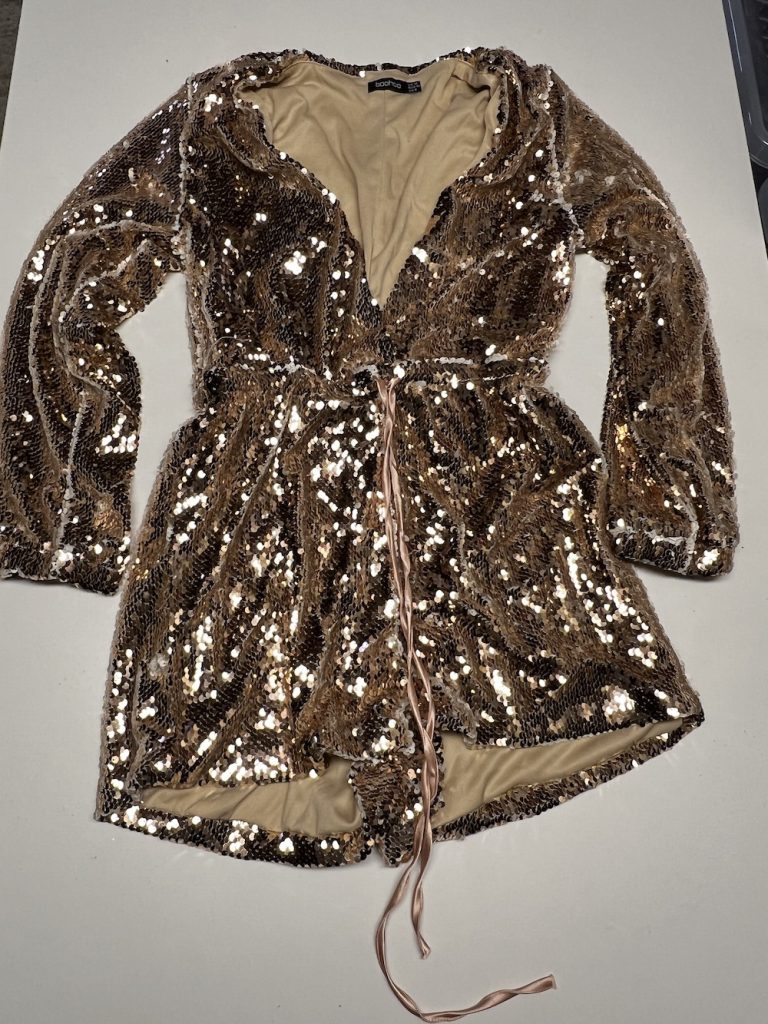 JUMPSUIT GOUD MET GLITTER